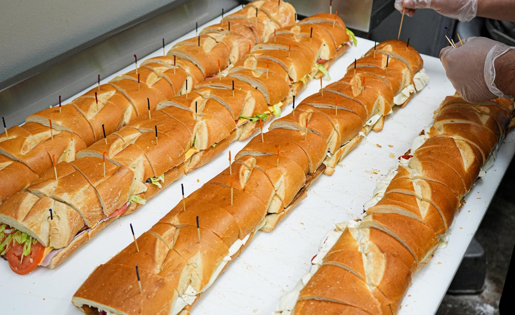 Party heros sliced and lined up for catering