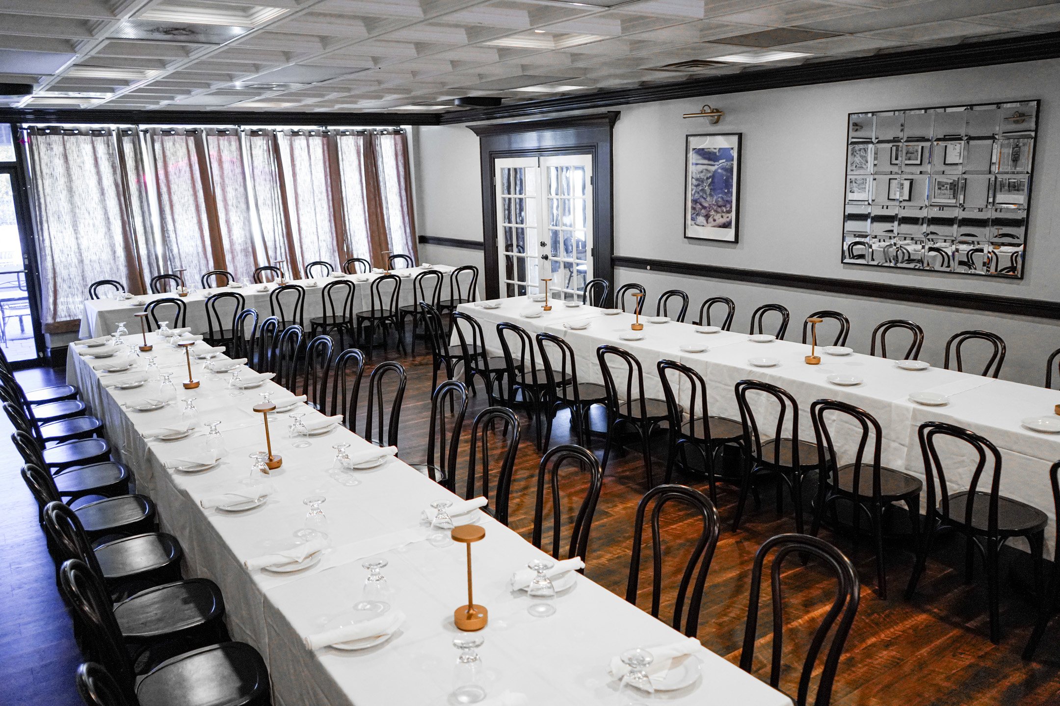 The party room set with long white-clothed tables