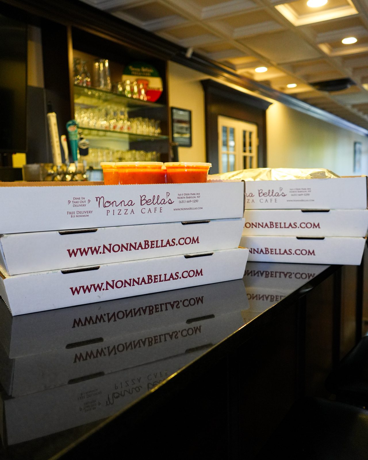 Catering orders boxed and stacked on the counter