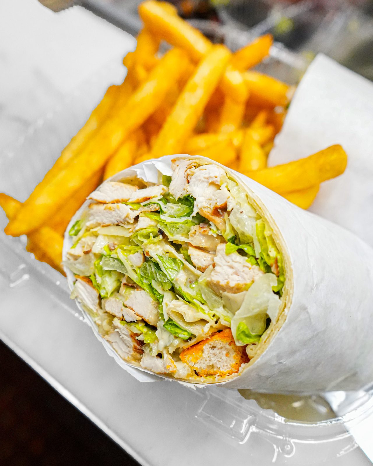 Chicken Caesar wrap with fries