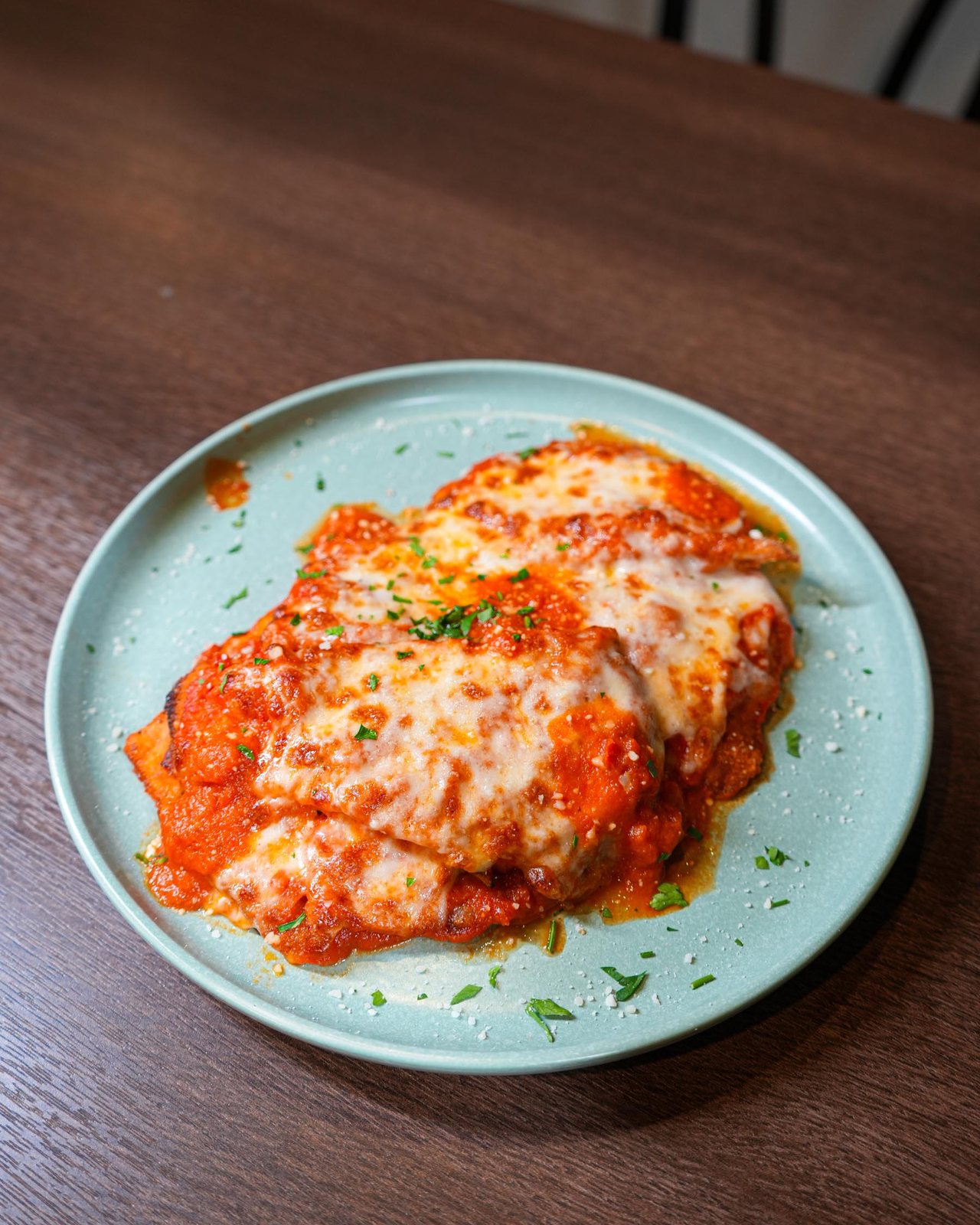 Chicken parm under melted mozzarella