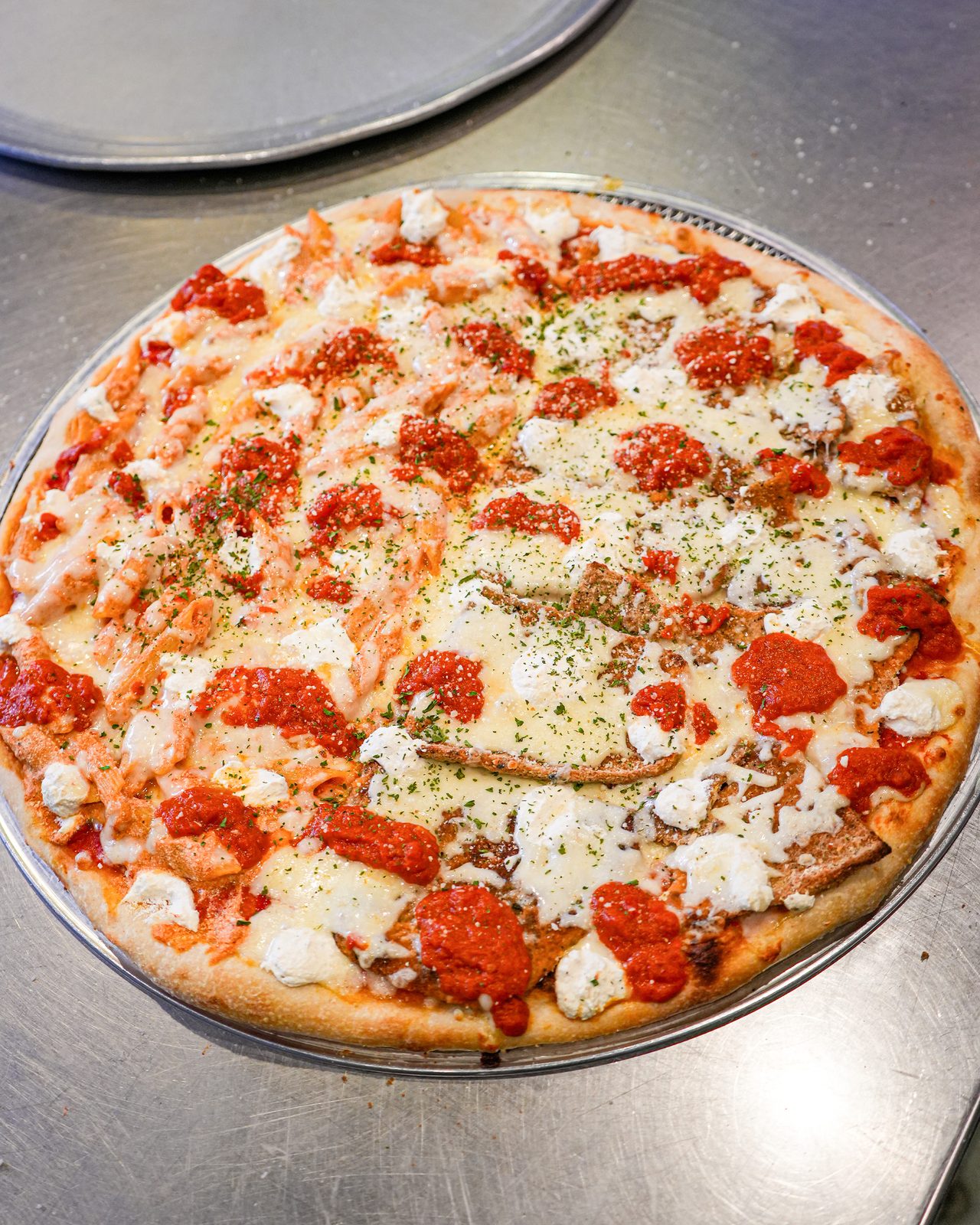 Round pie with fresh mozzarella and basil