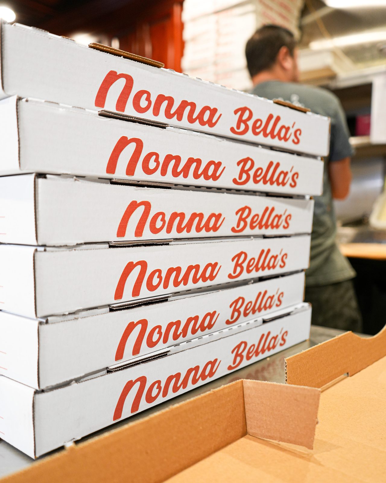 A stack of pies going out the door