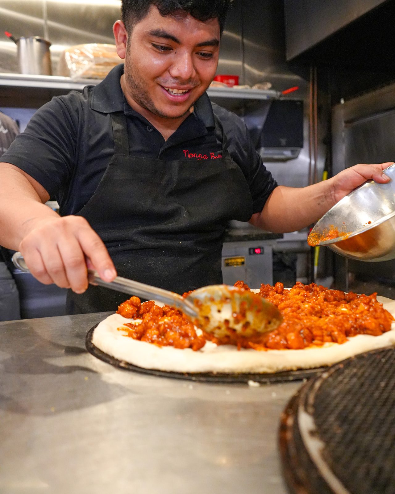 Topping a buffalo chicken pie