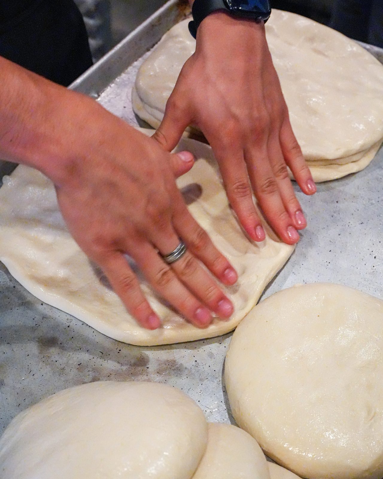 Stretching fresh dough by hand