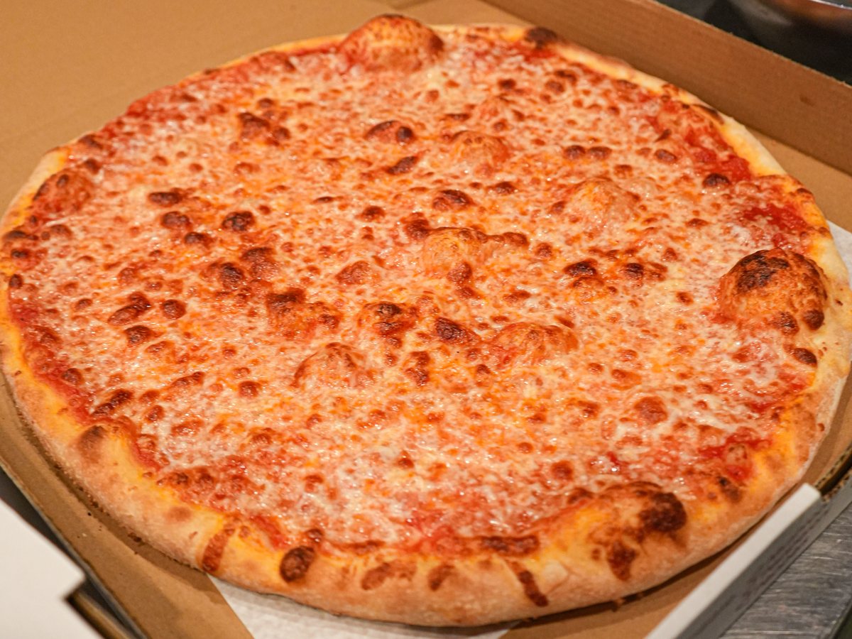 A whole plain cheese pie in its box